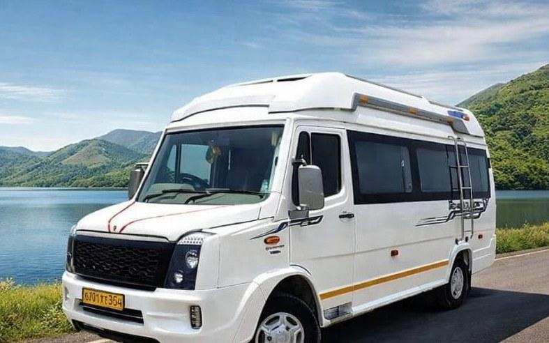 White 25-seater air-conditioned mini bus on a highway